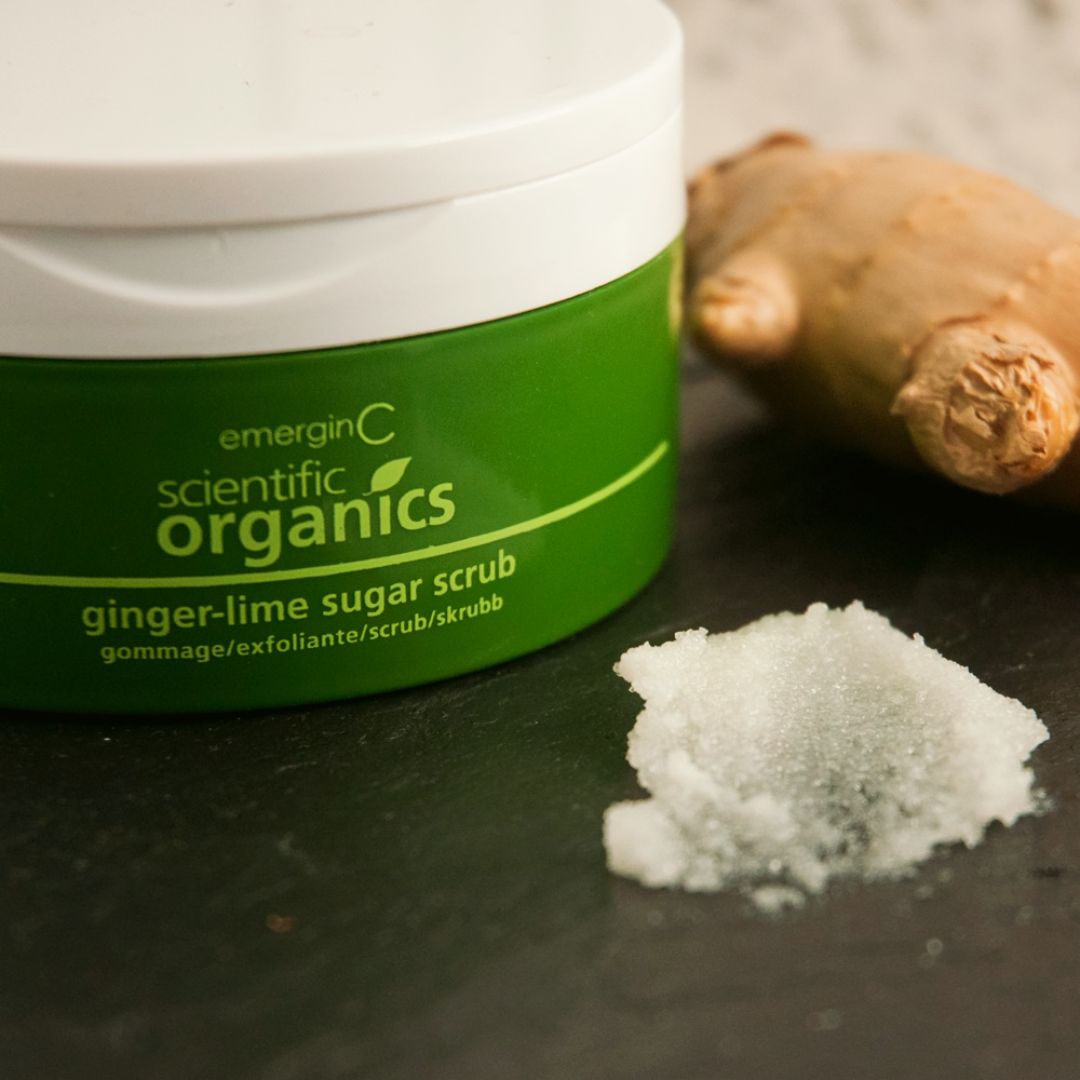 A creative product shot featuring Scientific Organics Ginger-Lime Sugar Scrub 189.9 g with ginger on the background, on Spa Circle Brands product listing page.
