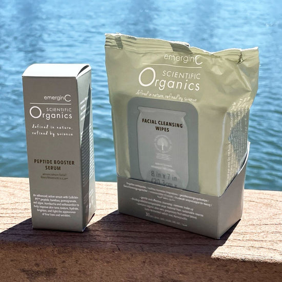 A creative product shot featuring Emergin C Scientific Organics Facial Cleansing Wipes (30 pieces) along with peptide booster serum, on Spa Circle Brands product listing page.